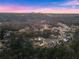 Expansive aerial shot of a residential area showcasing beautiful homes surrounded by lush landscapes at 6455 Quiet Cove Rd, Cumming, GA 30041