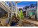 Landscaped backyard featuring a charming water feature and access to a relaxing hot tub area at 6455 Quiet Cove Rd, Cumming, GA 30041