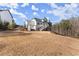 A large backyard with ample lawn space is ideal for outdoor recreation at 6455 Quiet Cove Rd, Cumming, GA 30041