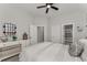 Bedroom with modern decor, a stylish mirror, and access to the bathroom at 6455 Quiet Cove Rd, Cumming, GA 30041