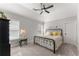Serene bedroom with vaulted ceiling, neutral tones, and comfortable furnishings at 6455 Quiet Cove Rd, Cumming, GA 30041