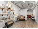 The bonus room features a comfortable seating area and shelving to display elegant decor at 6455 Quiet Cove Rd, Cumming, GA 30041