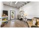 The bonus room includes a seating area and shelving to display seaside-themed decor at 6455 Quiet Cove Rd, Cumming, GA 30041