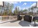 Spacious outdoor deck perfect for entertaining and grilling with a wooded view at 6455 Quiet Cove Rd, Cumming, GA 30041