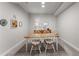 Charming dining room area with a table, chairs, and natural light, perfect for gatherings at 6455 Quiet Cove Rd, Cumming, GA 30041