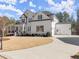 Beautiful home with a well-manicured lawn and a two-car garage for added convenience at 6455 Quiet Cove Rd, Cumming, GA 30041
