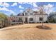 Lovely home boasting a welcoming front porch, pristine lawn, and classic architectural design at 6455 Quiet Cove Rd, Cumming, GA 30041