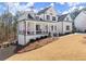Charming home with an inviting front porch and meticulously landscaped front yard at 6455 Quiet Cove Rd, Cumming, GA 30041
