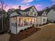 Desirable home with an inviting front porch, showcasing outdoor living and curb appeal at 6455 Quiet Cove Rd, Cumming, GA 30041