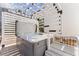 A relaxing hot tub is located on a private patio with a stylish pergola at 6455 Quiet Cove Rd, Cumming, GA 30041