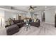 Inviting living room area with a plush sofa, neutral tones, and open layout at 6455 Quiet Cove Rd, Cumming, GA 30041