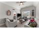 Cozy living room with vaulted ceiling, comfortable seating, and a view of the front yard at 6455 Quiet Cove Rd, Cumming, GA 30041
