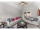 Inviting living room with elegant furnishings, neutral colors, and ample natural light at 6455 Quiet Cove Rd, Cumming, GA 30041