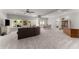 Spacious living room with abundant natural light, a comfortable seating area, and dining space at 6455 Quiet Cove Rd, Cumming, GA 30041