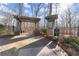 Charming entrance to the marina and nature trail, featuring a wooden pergola and informational signage in a natural setting at 6455 Quiet Cove Rd, Cumming, GA 30041