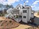 Beautiful two-story home featuring screened porch and outdoor living space at 6455 Quiet Cove Rd, Cumming, GA 30041