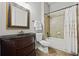 Full bathroom featuring a vanity with dark wood cabinets and a shower-tub combo at 654 Crystal Cove Ct, Loganville, GA 30052
