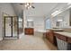 This spacious bathroom features a large soaking tub, tiled shower, and double vanities at 654 Crystal Cove Ct, Loganville, GA 30052