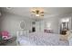 Cozy bedroom with ceiling fan and ensuite bathroom at 654 Crystal Cove Ct, Loganville, GA 30052