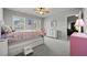 This bedroom features a double bed with windows overlooking the trees at 654 Crystal Cove Ct, Loganville, GA 30052