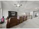 Bonus room with media center and comfortable seating at 654 Crystal Cove Ct, Loganville, GA 30052