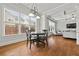 Bright breakfast nook open to the living room at 654 Crystal Cove Ct, Loganville, GA 30052