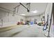 Spacious garage with ample storage space, including a corner dedicated to household items at 654 Crystal Cove Ct, Loganville, GA 30052