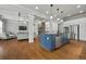 Spacious kitchen with blue island, stainless steel appliances, and an open layout to the living room at 654 Crystal Cove Ct, Loganville, GA 30052