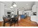 Open-concept kitchen with island, modern appliances, and hardwood floors at 654 Crystal Cove Ct, Loganville, GA 30052