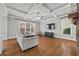Bright and airy living room with coffered ceiling, hardwood floors, and natural light at 654 Crystal Cove Ct, Loganville, GA 30052