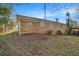 Expansive backyard showing the house and partially fenced in yard at 1997 Columbia Dr, Decatur, GA 30032