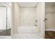 Bathroom area with a bathtub/shower combo and closet/laundry room nearby at 1997 Columbia Dr, Decatur, GA 30032