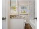 Modern bathroom showcasing marble-style tiling and a wood-look floor at 1997 Columbia Dr, Decatur, GA 30032