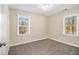 Cozy bedroom with neutral walls, new carpet, and natural lighting at 1997 Columbia Dr, Decatur, GA 30032