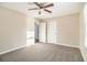 Neutral bedroom with a ceiling fan and carpet flooring, ample natural light at 1997 Columbia Dr, Decatur, GA 30032