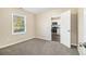 Comfortable bedroom featuring new carpeting and a view of the kitchen at 1997 Columbia Dr, Decatur, GA 30032