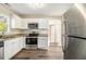 Modern kitchen with stainless steel appliances and white cabinets at 1997 Columbia Dr, Decatur, GA 30032