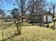 View of backyard with storage shed and a chain link fence at 212 Austin Ne Ave, Marietta, GA 30060