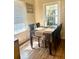 A dining room with a dark wood table and six chairs next to a window at 212 Austin Ne Ave, Marietta, GA 30060