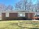 Front exterior of a one story brick home with a large front yard at 212 Austin Ne Ave, Marietta, GA 30060