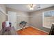 Cozy bedroom featuring ample storage and a well-lit window at 331 Cobblestone Rd, Auburn, GA 30011