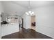 Bright dining area with wood floors, modern lighting and easy access to kitchen at 331 Cobblestone Rd, Auburn, GA 30011