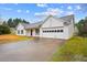 Attractive one-story home with a garage and black trimmed windows at 331 Cobblestone Rd, Auburn, GA 30011