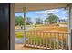 The front porch with a view of the lawn and neighboring homes beyond at 331 Cobblestone Rd, Auburn, GA 30011