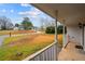 Inviting front porch view of the home with a spacious front yard and street view at 331 Cobblestone Rd, Auburn, GA 30011