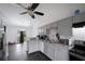 Well-lit kitchen with stainless steel appliances, gray cabinets, and granite countertops at 331 Cobblestone Rd, Auburn, GA 30011