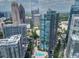 Stunning aerial view of the community with high-rise buildings, swimming pool, and city skyline at 1080 Peachtree Ne St # 1902, Atlanta, GA 30309