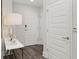 Modern entryway with white doors, wood floors, and decorative lighting at 1080 Peachtree Ne St # 1902, Atlanta, GA 30309