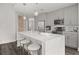 Modern kitchen with stainless steel appliances, pendant lighting, and a large island with seating at 1080 Peachtree Ne St # 1902, Atlanta, GA 30309