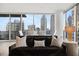 Stylish living room offers comfortable seating and city views from floor-to-ceiling windows at 1080 Peachtree Ne St # 1902, Atlanta, GA 30309